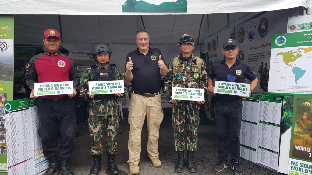 Freeland's Surviving Together Program Director with rangers and officials from the DNP